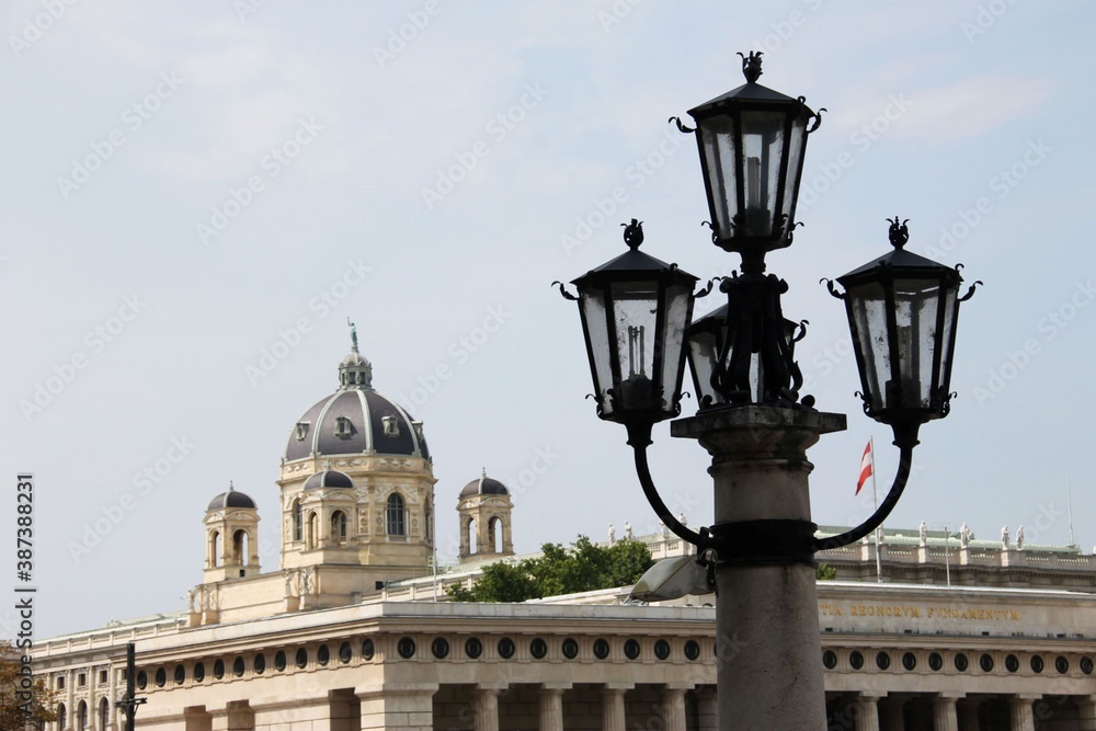 street lamp next to a dome in streets of Vienna