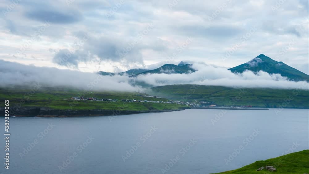 Remote green faroe island mountains with passing clouds timelapse Remote green faroe island mountains with passing clouds timelapse