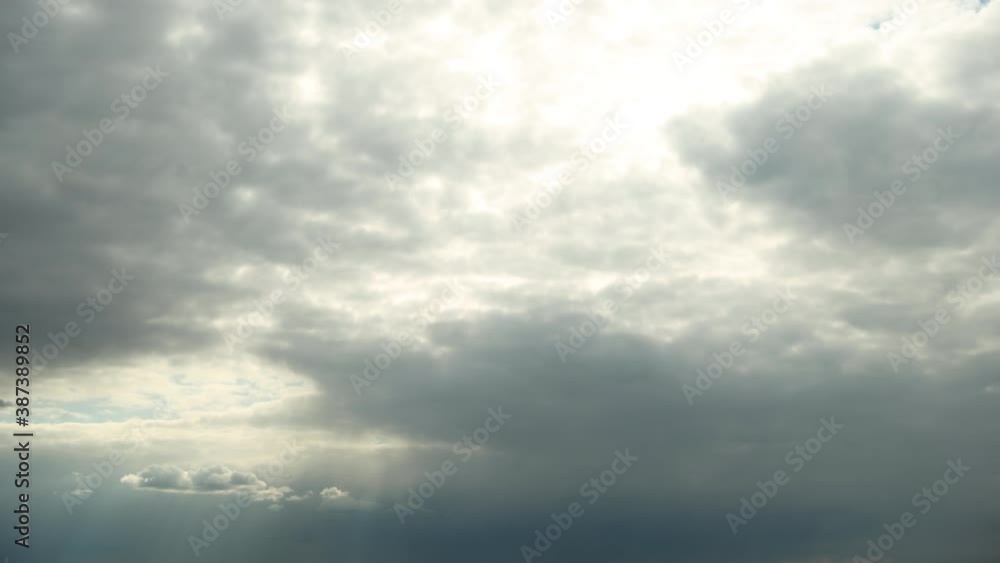 Sun Rays Shining Through Cloudy Rainy Sky With Rain Clouds. Sky Natural Background. Weather Forecast Concept. Time-lapse Timelapse 4K Sun Rays Shining Through Cloudy Rainy Sky With Rain Clouds. Sky Natural Background. Weather Forecast Concept. Time-lapse Timelapse 4K