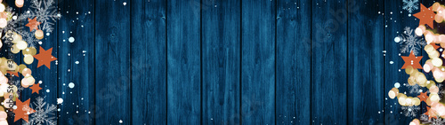 Christmas / Advent background banner Panorama, card template -Orange stars, bokeh lights, ice crystals and snowy snowflakes, isolated on dark blue wooden bards wall texture wood, with copy space