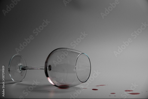 Overturned glass and spilled wine 