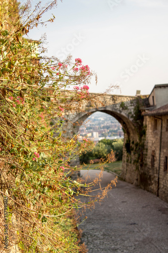 Close up. Medieval castle  Castello di Brescia  with battlements  a tower  drawbridge and ramparts. Lombardy  Italy