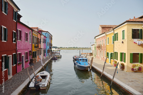 Burano is an island in the Venetian Lagoon, northern Italy, near Torcello at the northern end of the lagoon, known for its lace work and brightly coloured homes. © peacefoo