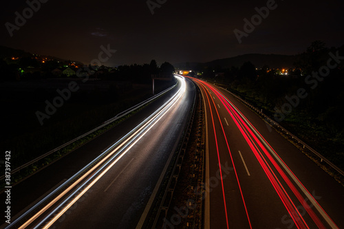 Motion blur with car light traisl on a road © Bernd Schmidt