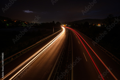 LIght trails of cars in the night road