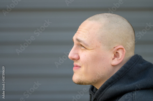 Photography Profile of a casual young man with shaved head