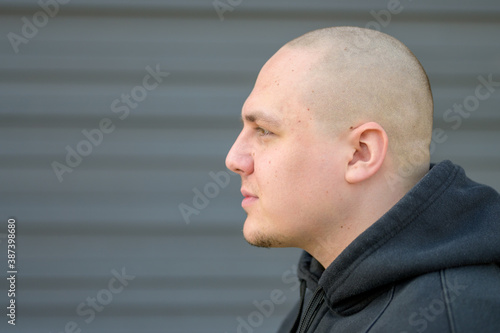 Bild auf Leinwand Profile of a modern young man with shaved head