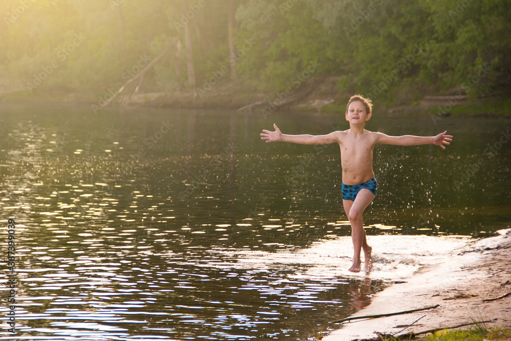 child playing by the water on the lake child playing by the water on the lake