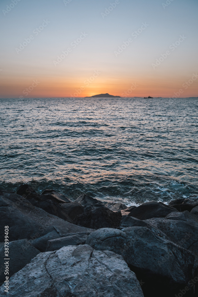 Sunset behing Ischia Island on the Sorrento Coast in Italy