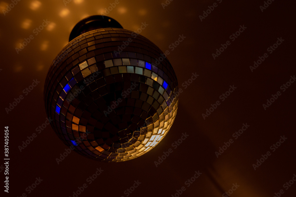 Obraz premium mirror ball on which the spotlight shines