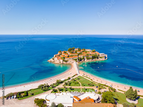 Fototapeta Naklejka Na Ścianę i Meble -  Famous Sveti Stefan island in Budva during a summer day, Montenegro. Drone aerial photo