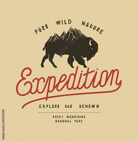 Bison hiking t-shirt print. Bison with a mountain range on its back. Pure wild nature expedition typography vector illustration.