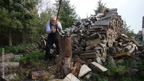 man chops wood