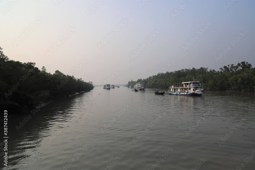 Launches on the river at the largest mangrove forest- Sundarbans in Bangladesh