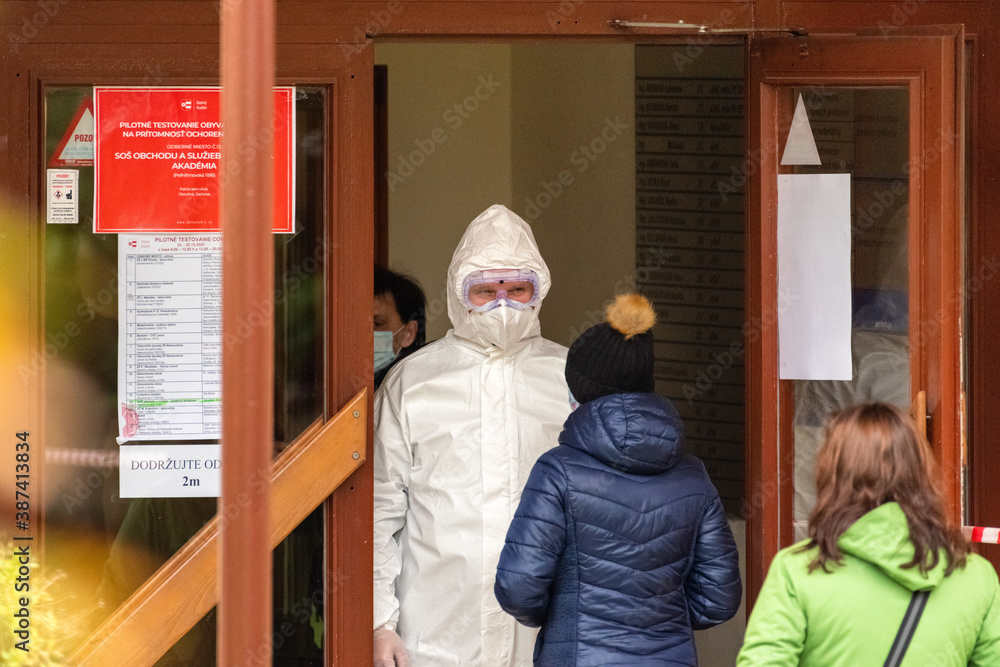 Medic in protective suit at checkpoint Medic in protective suit at checkpoint