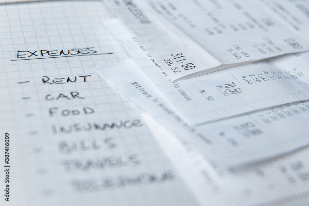 List of daily living expenses, with tax receipts next to it. List of daily living expenses, with tax receipts next to it.