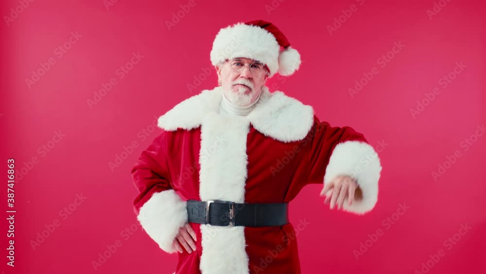 strict santa claus with hands on hips wagging finger isolated on red strict santa claus with hands on hips wagging finger isolated on red