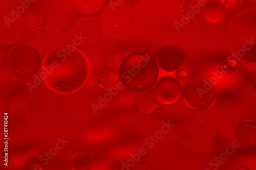 Red glitter vintage lights background. Red texture background. Oil drops in water.