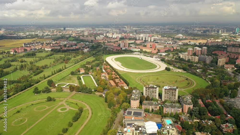 Milan, Italy: Aerial view of city outskirts with sport complex - landscape panorama of Europe from above Milan, Italy: Aerial view of city outskirts with sport complex - landscape panorama of Europe from above