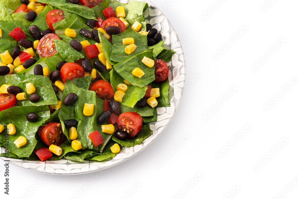 Mexican salad with black beans, corn,tomatoes,lettuce and pepper isolated on white background Mexican salad with black beans, corn,tomatoes,lettuce and pepper isolated on white background