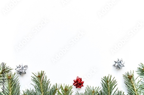 Christmas background. Branches of a Christmas tree on a white background. Top view.
