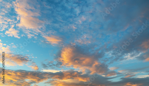 Beautiful colorful bright sunset sky with orange clouds. Nature sky background.    © Inga Av