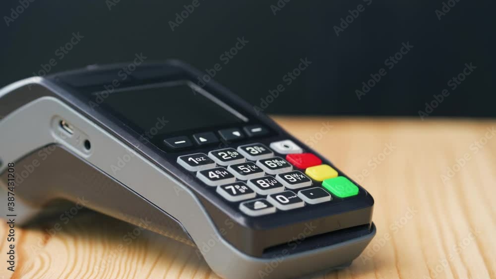 Contactless payment with smartphone. Wireless payment concept. Close-up, woman using smartphone cashless wallet NFC technology to pay order on bank terminal. Contactless payment with smartphone. Wireless payment concept. Close-up, woman using smartphone cashless wallet NFC technology to pay order on bank terminal.