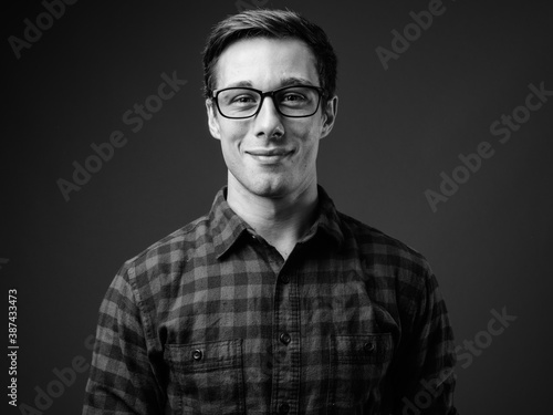 Young handsome hipster man in black and white