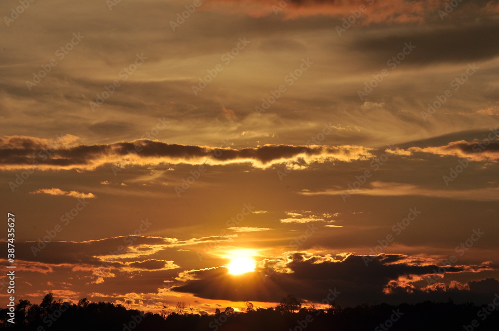 Sunset view with beautiful golden sky,the colorful sky lights in the evening Sunset view with beautiful golden sky,the colorful sky lights in the evening