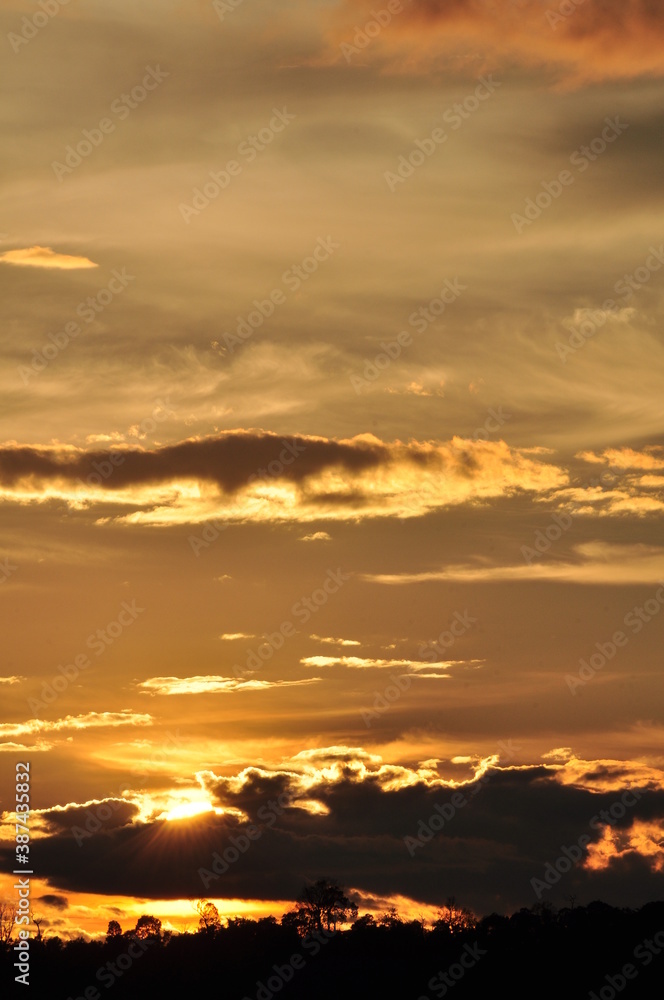 Sunset view with beautiful golden sky,the colorful sky lights in the evening	