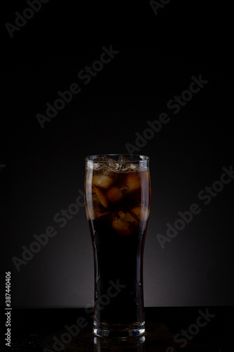 Glass of pop soda drink in a studio shot.
