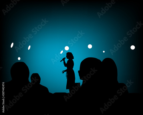 Spectators in nightclub in front of the screen. Silhouettes of people
