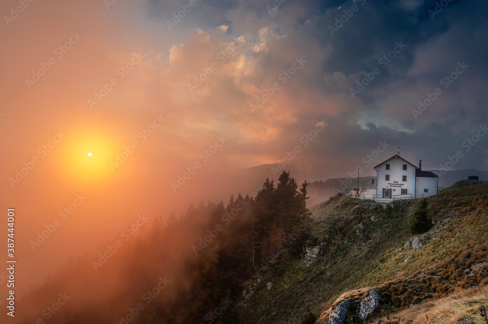 18 october 2020, Cloudy sunset on the top of mount Pizzoc (Veneto region, Italy). On the background the Vittorio Veneto hut