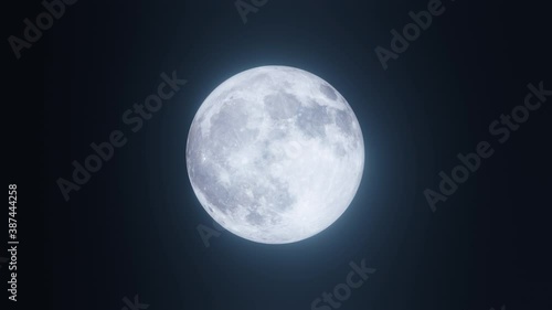 Moon with changing Phases, detailed surface and lunar craters with seas in the dark night sky - Full cycle. Looped video of a glowing satellite isolated on black.