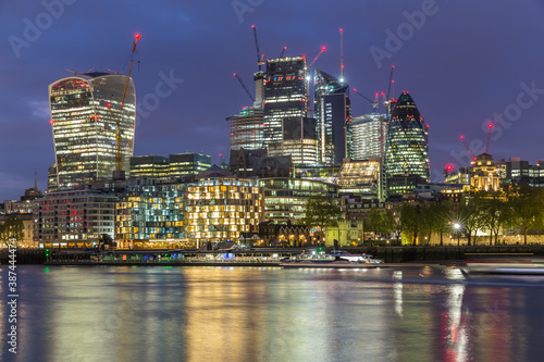 London business district at night by the Thames