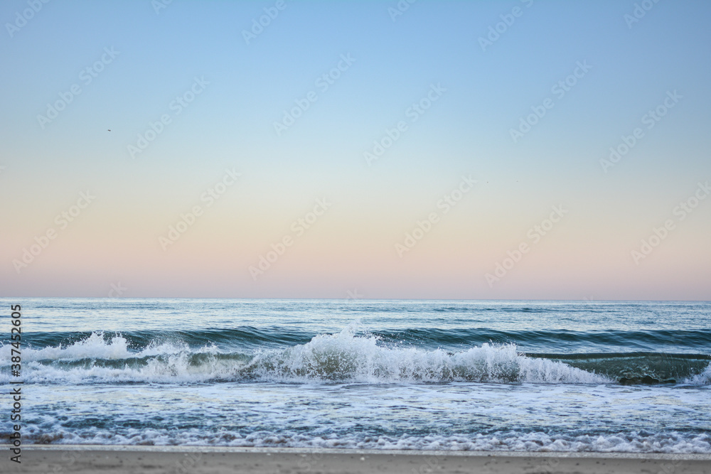 Crest of a wave in the Black Sea at sunset, selective focus. Sea waves background series images.