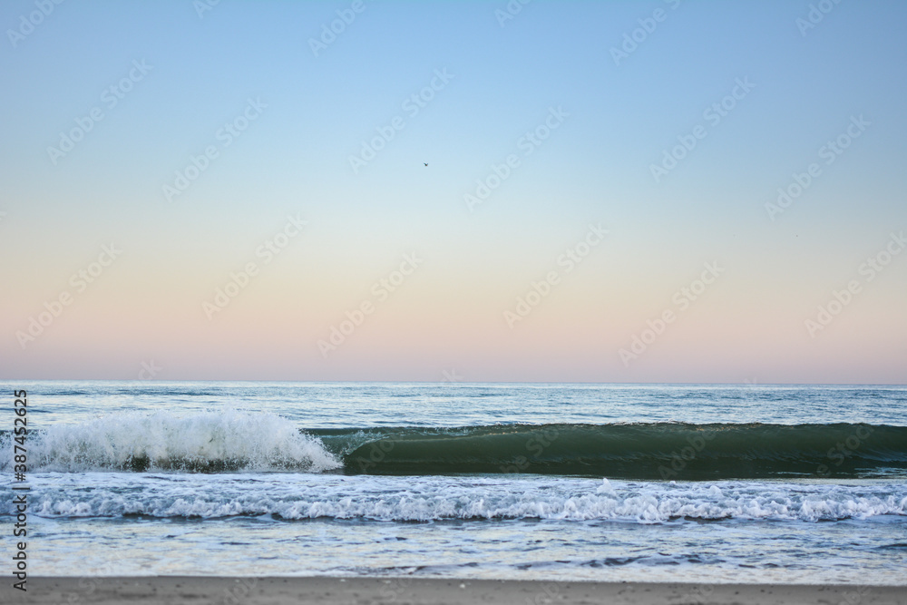 Crest of a wave in the Black Sea at sunset, selective focus. Sea waves background series images.