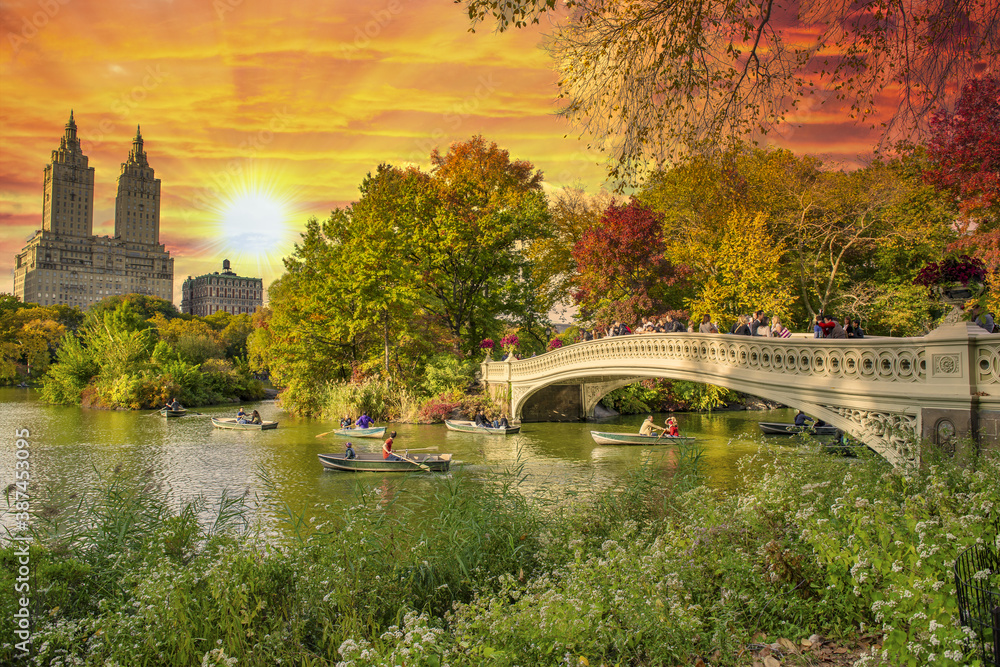 Beautiful foliage colors of Central Park, Manhattan. Bow Bridge and The Lake at dusk, New York City