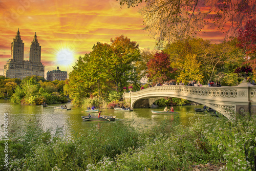 Beautiful foliage colors of Central Park  Manhattan. Bow Bridge and The Lake at dusk  New York City