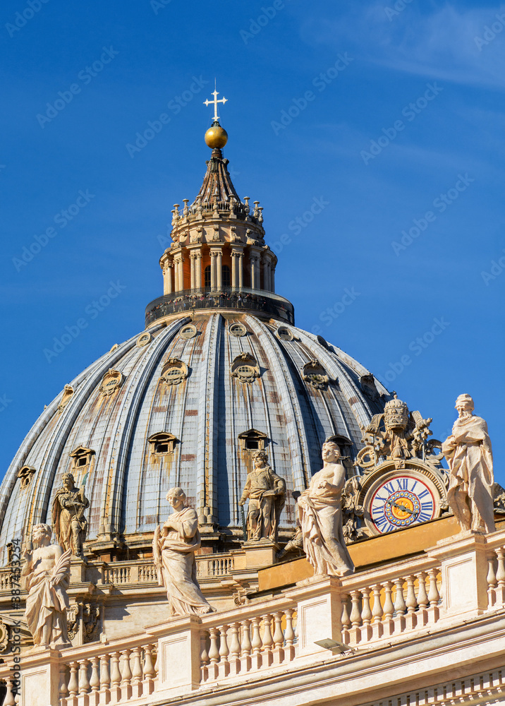 Clocks and sculptures of saints at St. Peter's Basilica in the Vatican. Rome. Italy.
