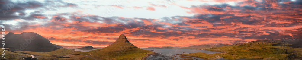Sunset sky colors over Kirkjufell Mountain, panoramic aerial view