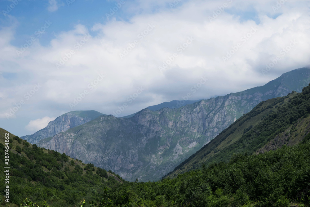 View of the mountains of the North Caucasus. Mountains in the clouds in summer