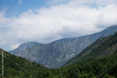 View of the mountains of the North Caucasus. Mountains in the clouds in summer © ele4448