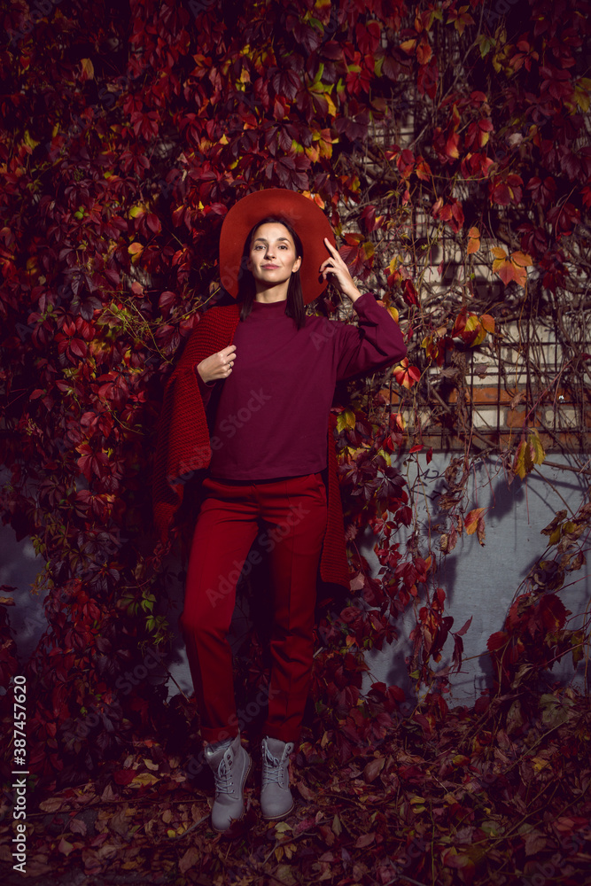 woman in a red hat and red sweater woman in a red hat and red sweater