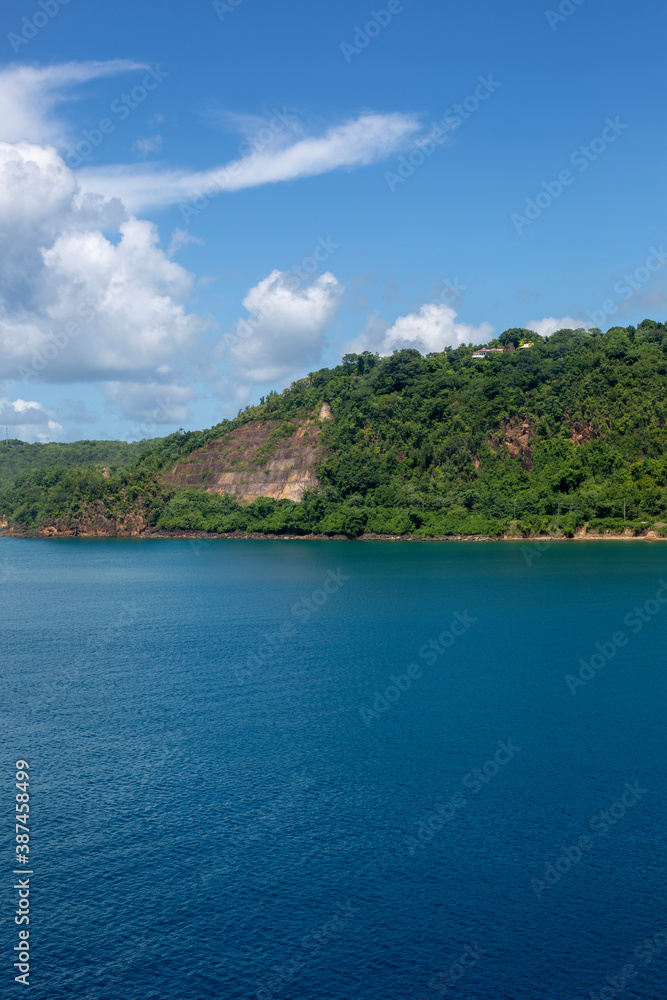 Naklejka premium Panoramic view of Saint Lucia in the Caribbean, beautiful view of the mountains, blue water and blue sky.