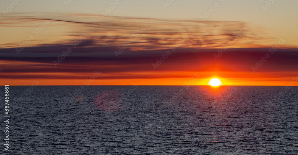 Fototapeta premium Sea sunset, view from the ship, sunset from the ship