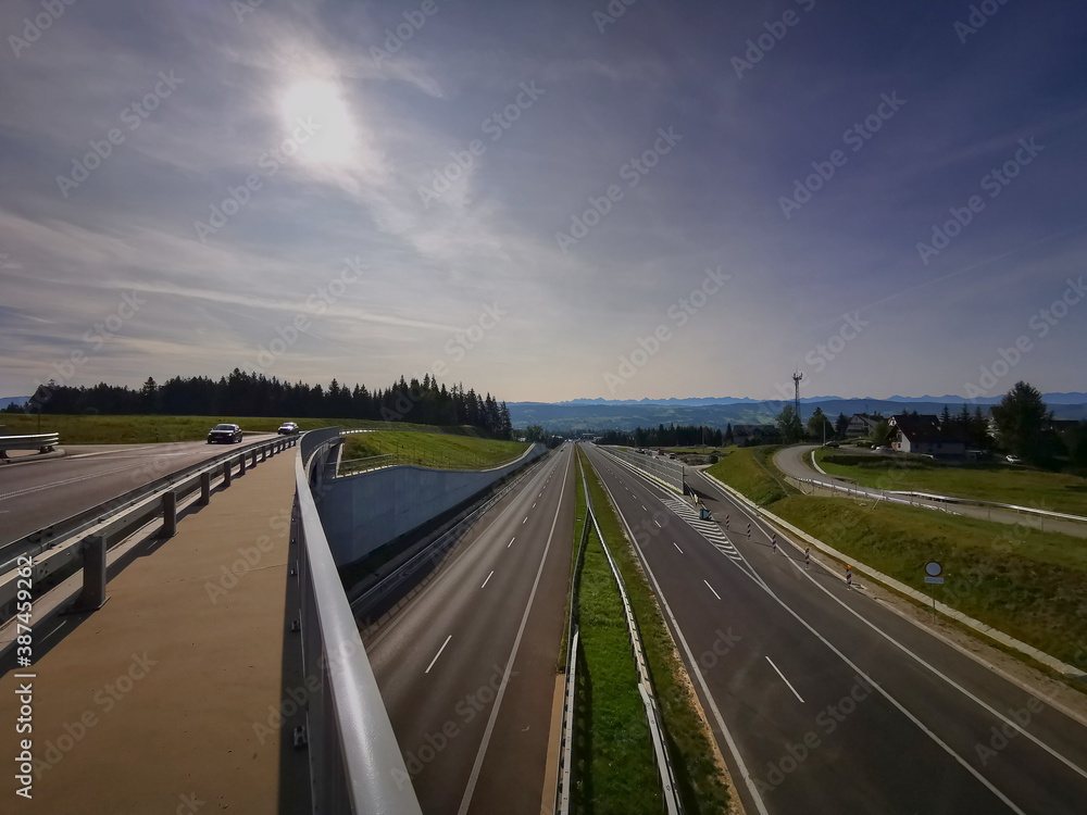 Fototapeta premium Lesser Poland Voivodeship Poland. September 2020. An empty road to the Tatra Mountains in Zakopane. Zakopianka