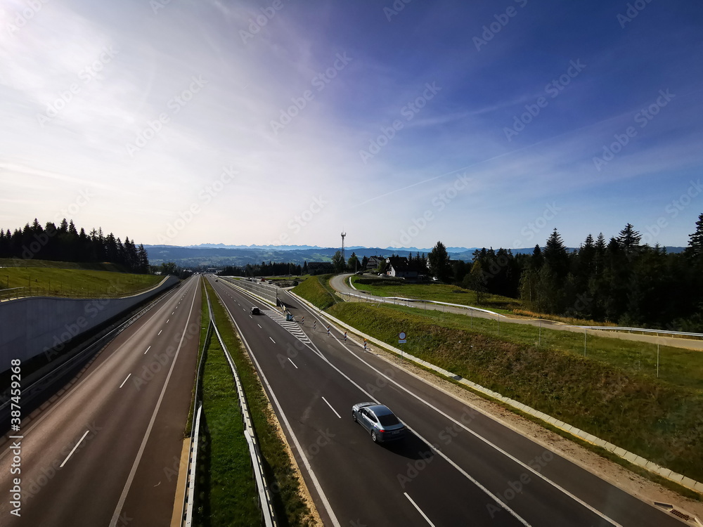Fototapeta premium Lesser Poland Voivodeship Poland. September 2020. An empty road to the Tatra Mountains in Zakopane. Zakopianka