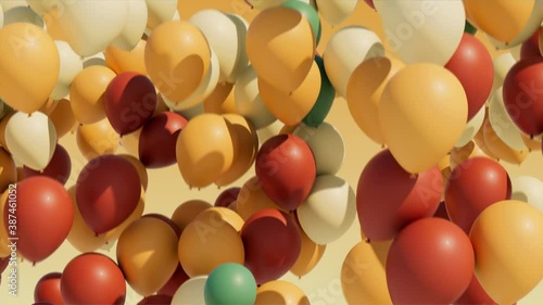 Colorful balloons rising into the in the air. Seamless loop.