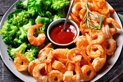 Garlic butter prawns with broccoli, top view